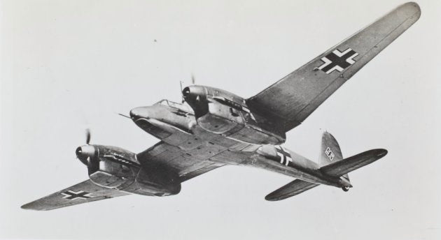 Vintage black and white photograph of a German military airplane with a visible insignia.